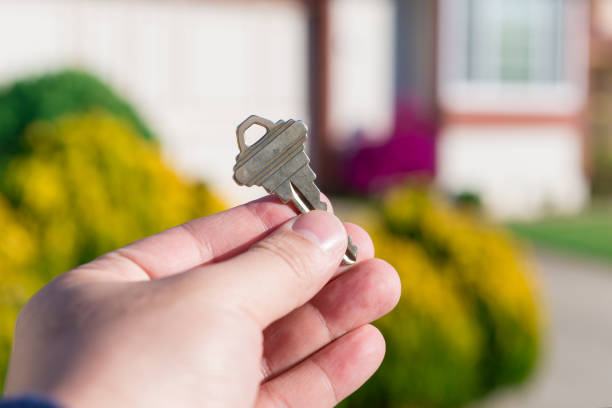 istock handing key in a house background 1844130260