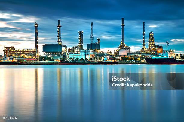 Oil Refinery With Reflection Petrochemical Plant Stock Photo - Download Image Now - Crude Oil, Refinery, Chemical Plant