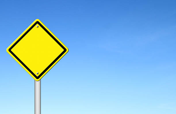 istock blank yellow traffic sign with blue sky 184413937