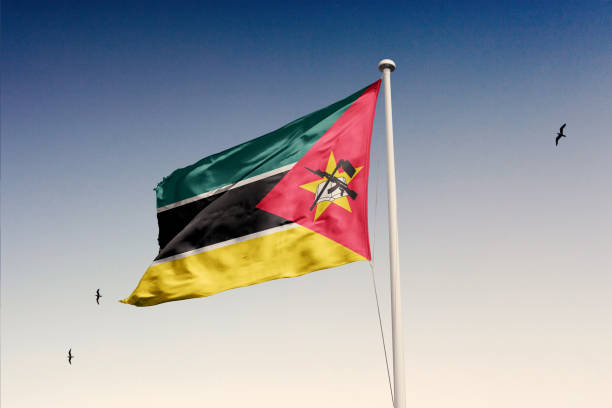 istock Mozambique flag fluttering in the wind on sky. 1844149315