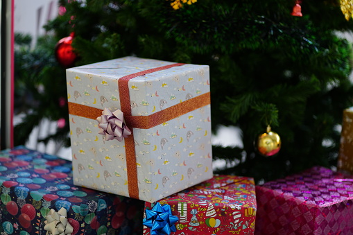 Gift Box Below Christmas Tree and Happy new year