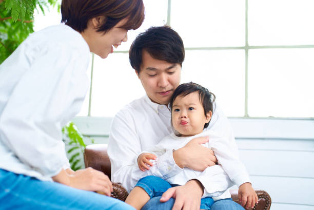 istock A family of three relaxing with a smile 1844161332