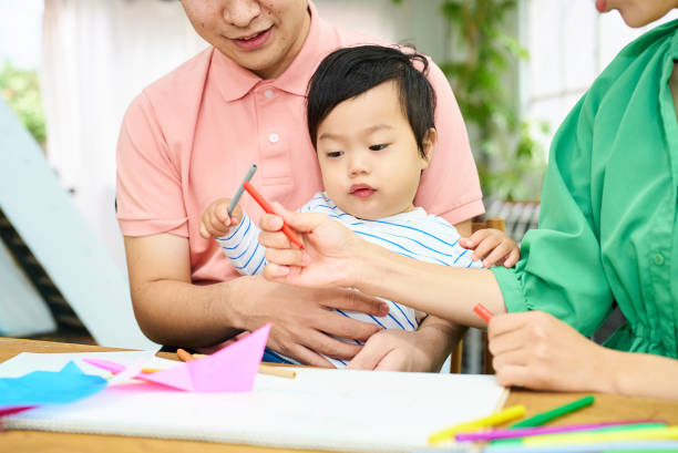 istock Parents and children playing and drawing 1844172715