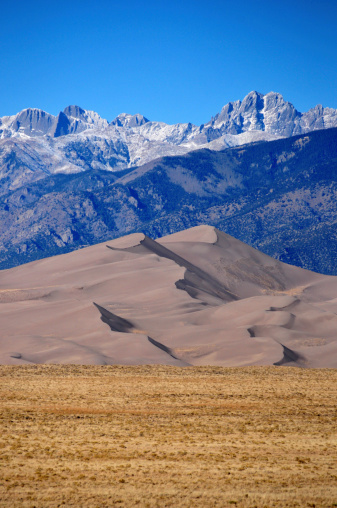 Great Sand Dunes National Park, CO, USA: sand dunes between the plain of the San Luis Valley and the snow covered Sangre de Cristo Mountains - photo by M.Torres