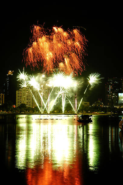 istock Beautiful colorful fireworks with night sky and lake reflections 184420056