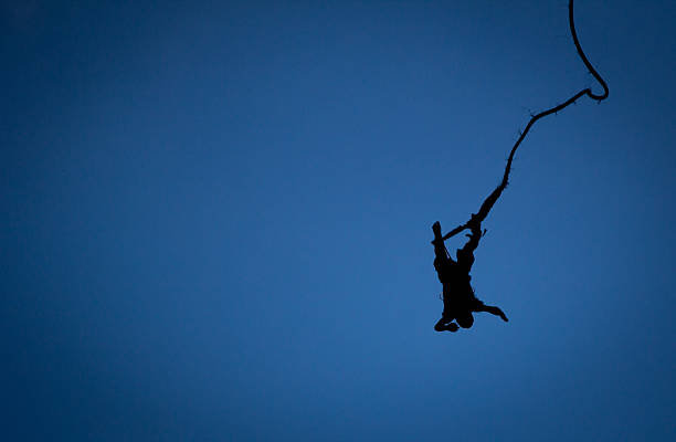 Bungee Silhouette Bungee jumper bouncing back leap of faith stock pictures, royalty-free photos & images