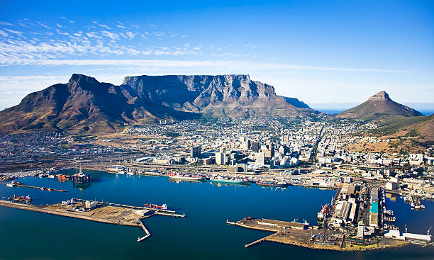 Table Mountain and Cape Town Harbour, South Africa Aerial view of Cape Town city centre, with Table Moutain, Cape Town Harbour, Lion's Head and Devil's Peak malay quarter photos stock pictures, royalty-free photos & images