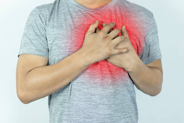 istock asian man pressing chest with painful expression. Severe heartache, having a heart attack or painful cramps, heart disease. 1844227681
