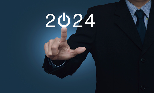 Businessman pressing 2024 start up business flat icon over light blue background, Business happy new year 2024 cover concept