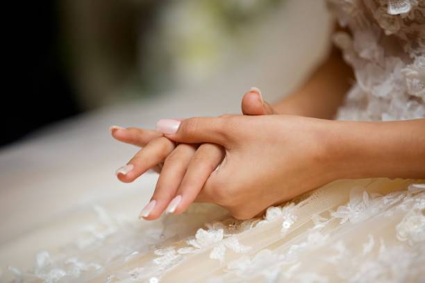istock Elegant female hands of bride 1844247147
