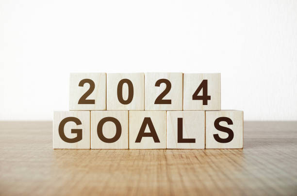 istock 2024 Plans word on table background. Resolution, strategy, solution, goal, business and New Year holiday concepts 1844250283