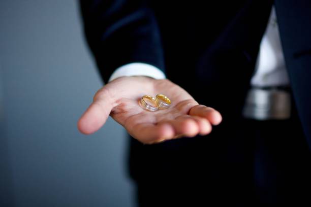 istock Strong men's hands and wedding rings 1844258021