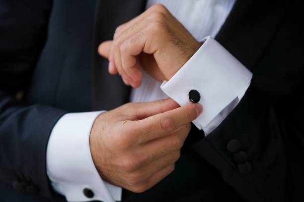 istock Men's hands correct shirt with cufflinks 1844259058