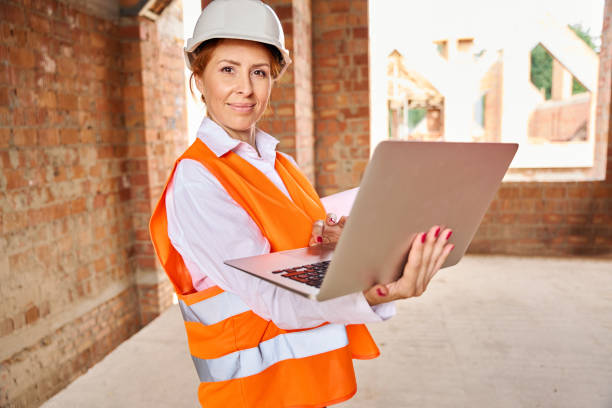 istock Construction supervisor using laptop during inspection of residential house 1844270824