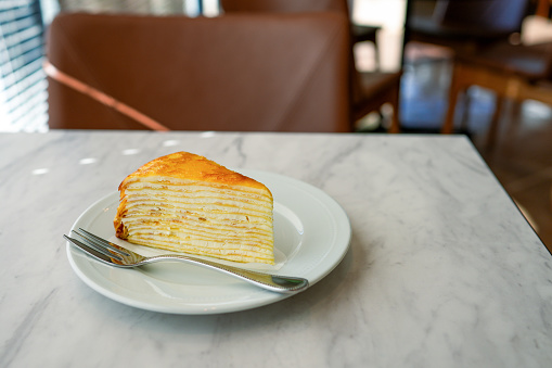 Mille Crepe on a table at a cafe
