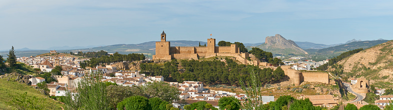 Moorish castle overlooking Spanish city of Antaquira at sunrise.