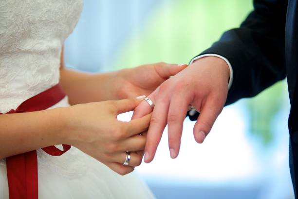 istock The bride and groom put the ring on the wedding ceremony 1844330356