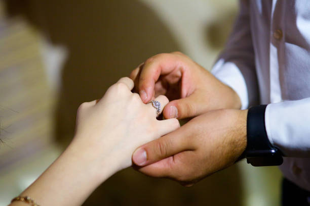 istock The bride and groom put the ring on the wedding ceremony 1844331386