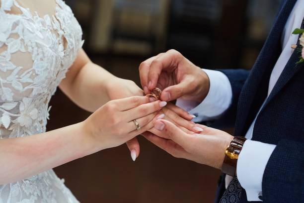 istock The bride and groom put the ring on the wedding ceremony 1844335898