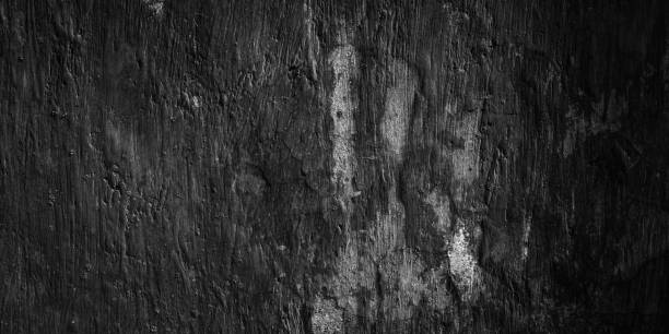 istock Abstract dark black grungy wall texture background 1844338689