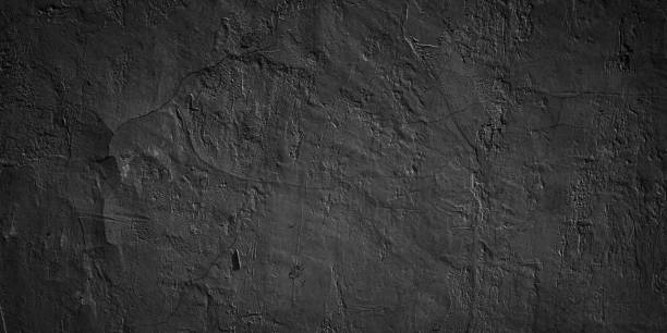 istock Abstract dark black grungy wall texture background 1844338694