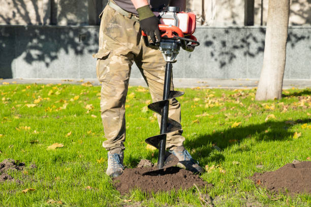 istock Gardener using tools hand-held soil hole drilling machine or portable manual earth auger. 1844377447