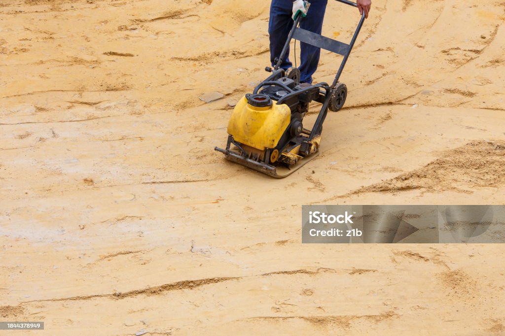 Work Using Sand Worker Using Vibratory Plate Compactor For Compaction Sand During Path ...