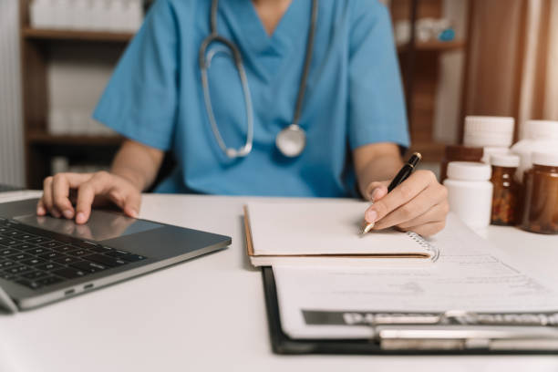 istock Medical Technology Concepts. Medical students use laptop computer to search for information in a modern office in the morning at the desk. 1844383258