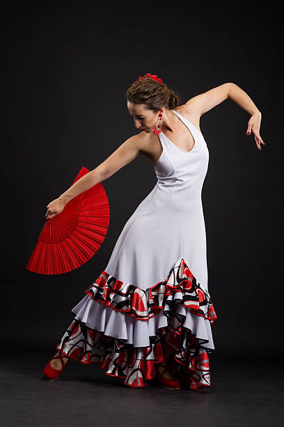 istock Spanish woman dancing flamenco on black 184439959