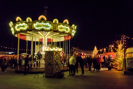 Zurich, Switzerland - December 8, 2022: Vintage carousel (merry-go-round) in at the Zurich Christmas Market, Switzerland
