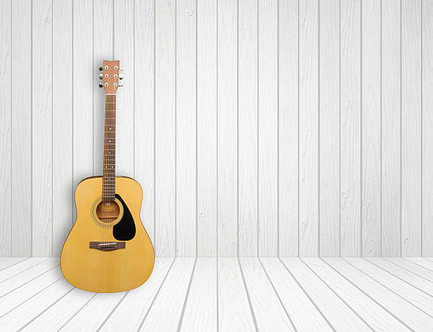 istock Guitar in white wood room 184443513