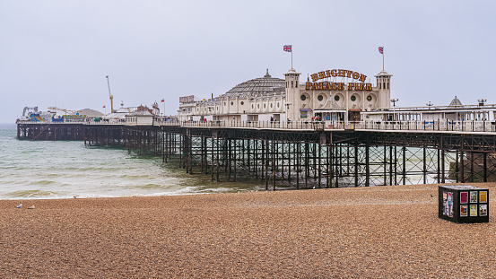 Brighton, East Sussex, England, UK - May 10, 2022: The beach and the Palace Pier