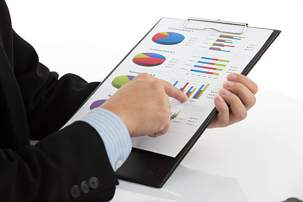 istock Hand with finance report 184446502