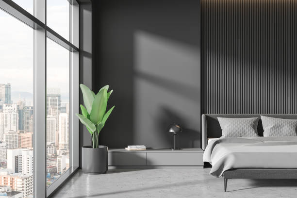 istock Grey home bedroom interior with bed and drawer with decor, panoramic window 1844482341
