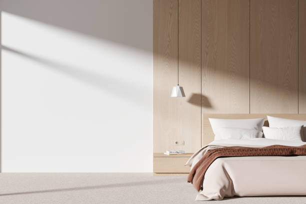 istock White and wooden bedroom interior with blank wall 1844482885