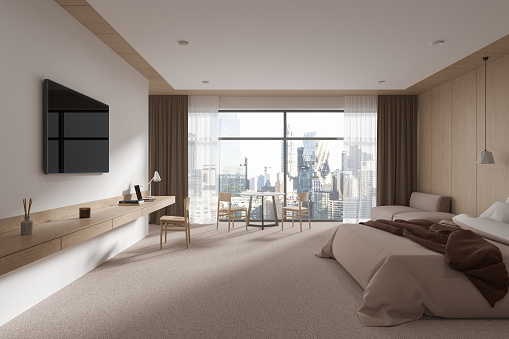 Beige modern hotel bedroom interior bed and dining table with chairs, tv display and console. Luxury relax room with panoramic window on New York. 3D rendering