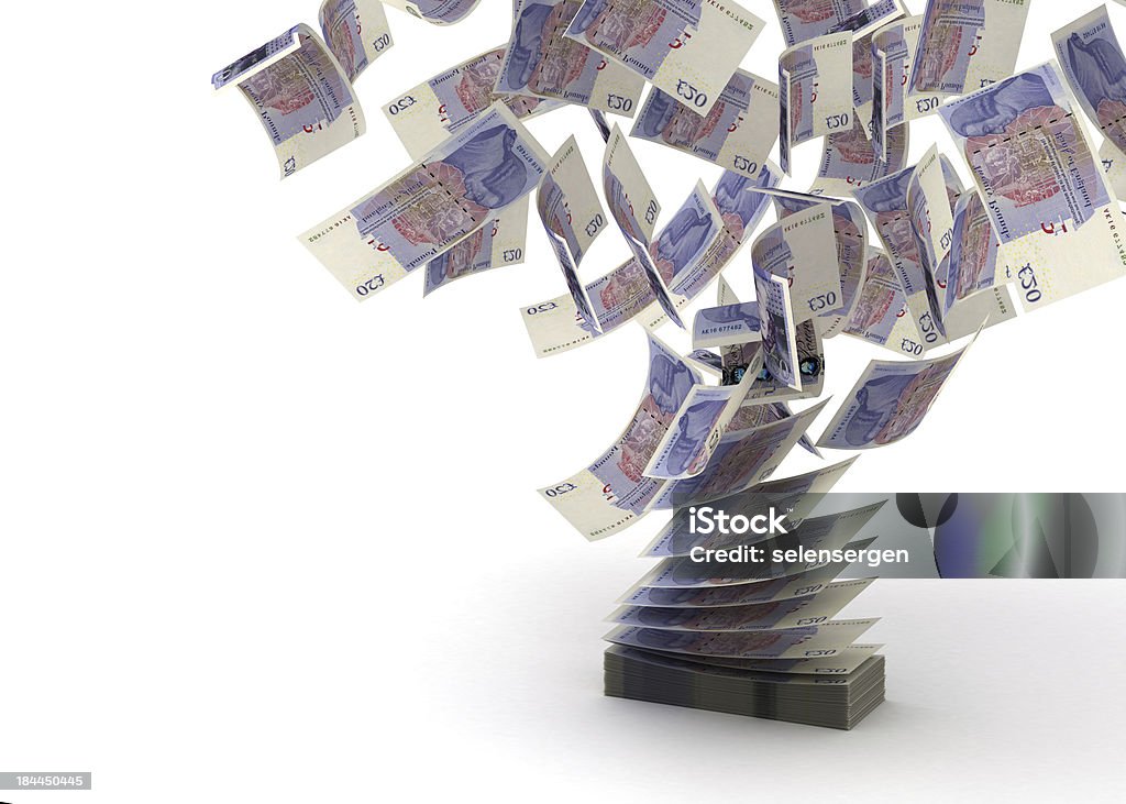 Block of bank notes flying swap Flying Pounds (isolated with clipping path) British Currency Stock Photo