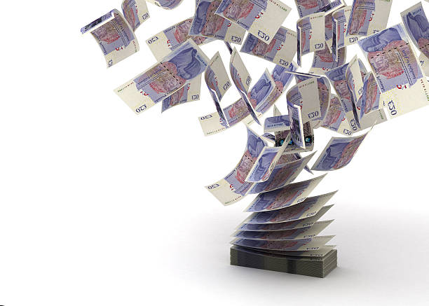 Block of bank notes flying swap Flying Pounds (isolated with clipping path) british currency stock pictures, royalty-free photos & images