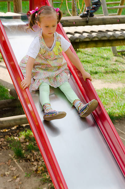 istock little girl on the playground 184451214
