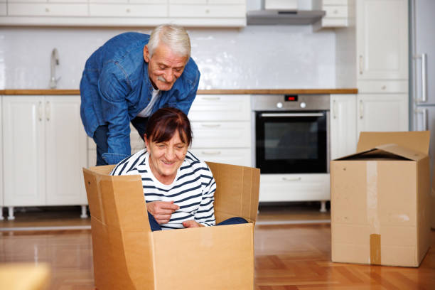 istock Happy senior couple moving into new apartment 1844521778