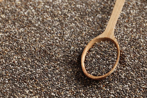 istock A wooden spoon in chia close-up. Top view. Place for text. 1844528886