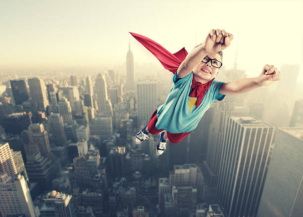 istock Little superhero boy flying in the air 184453337
