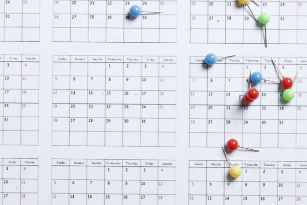 istock Many colored pins on the calendar. Place for text. Planning concept. 1844537780