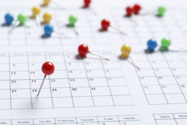 istock Many colored pins on the calendar. Place for text. Planning concept. 1844538284