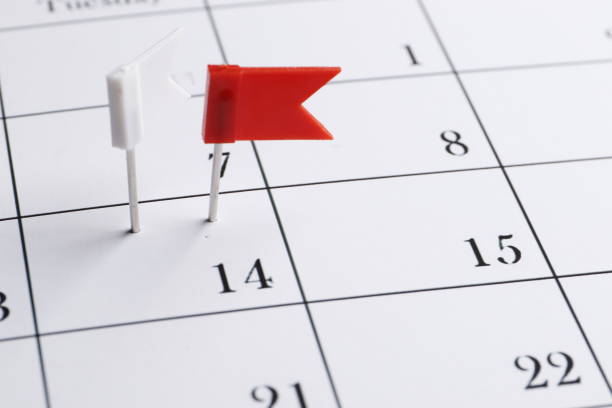 istock Red pin on a date on a calendar closeup. Important date. Place for text. Planning concept. 1844538824