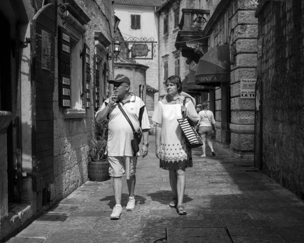 Couple walking down the street stock photo