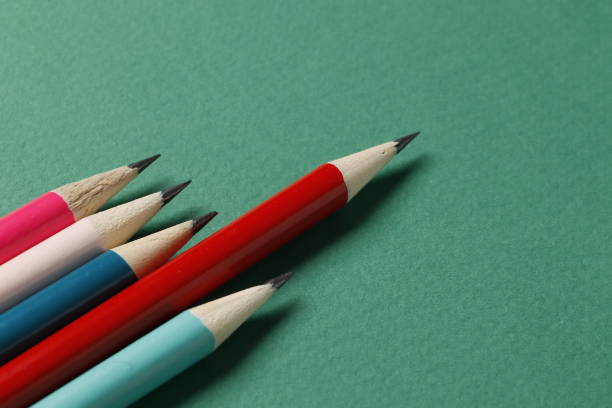 istock Color pencils on a green background. Place for text 1844546835