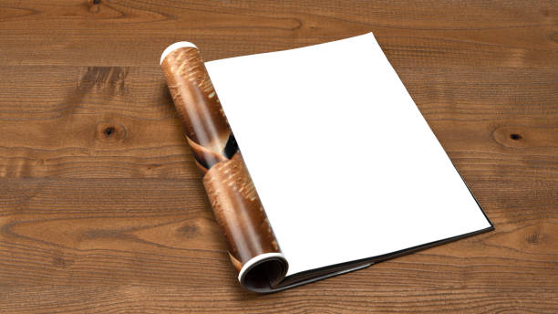 istock magazine page is open on wooden table 1844553967