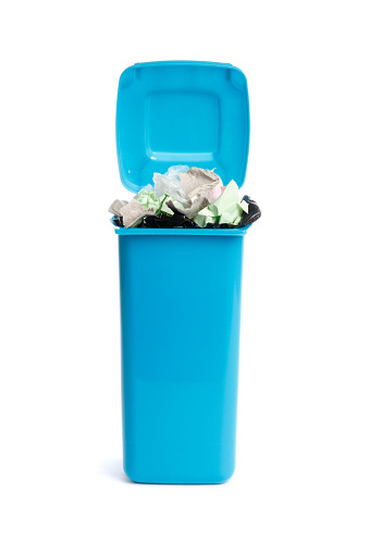 Trash bin with garbage on white background. Waste recycling