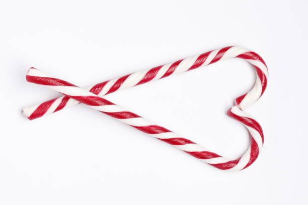 istock Tasty red candy cane  on white background. Festive treat 1844581325